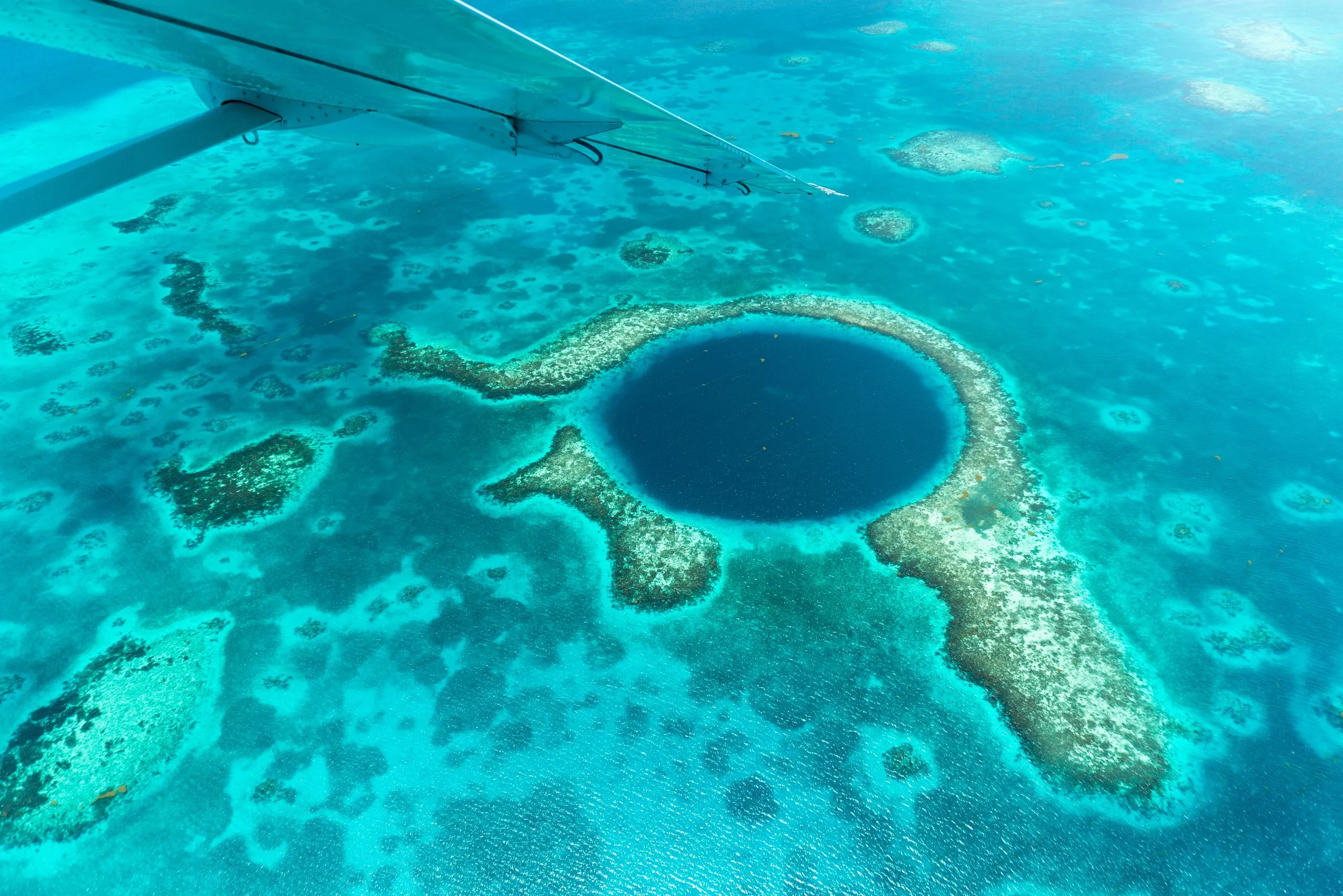 aerial view of the great blue hole, one of the best things to do in belize