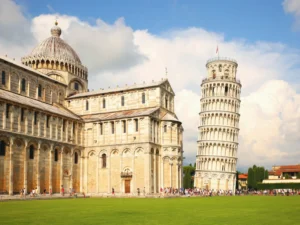 leaning tower of pisa italy with baptistery visible to the left, an essential view when taking a day trip to pisa from florence