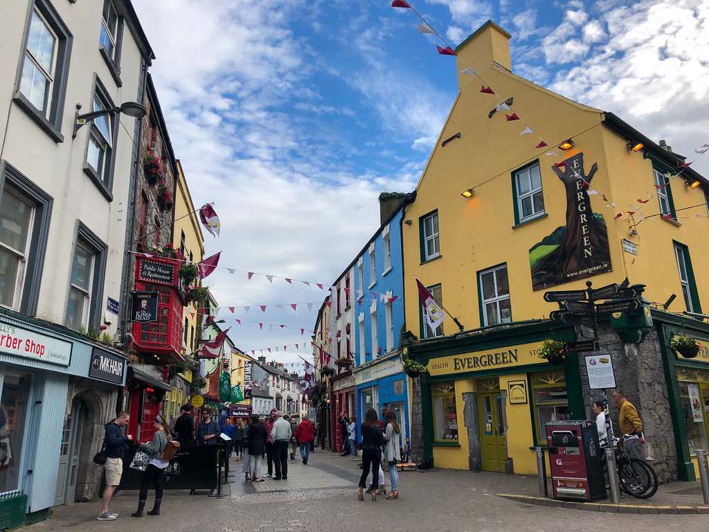 photo of colorful buildings in galway city center on a partly sunny day